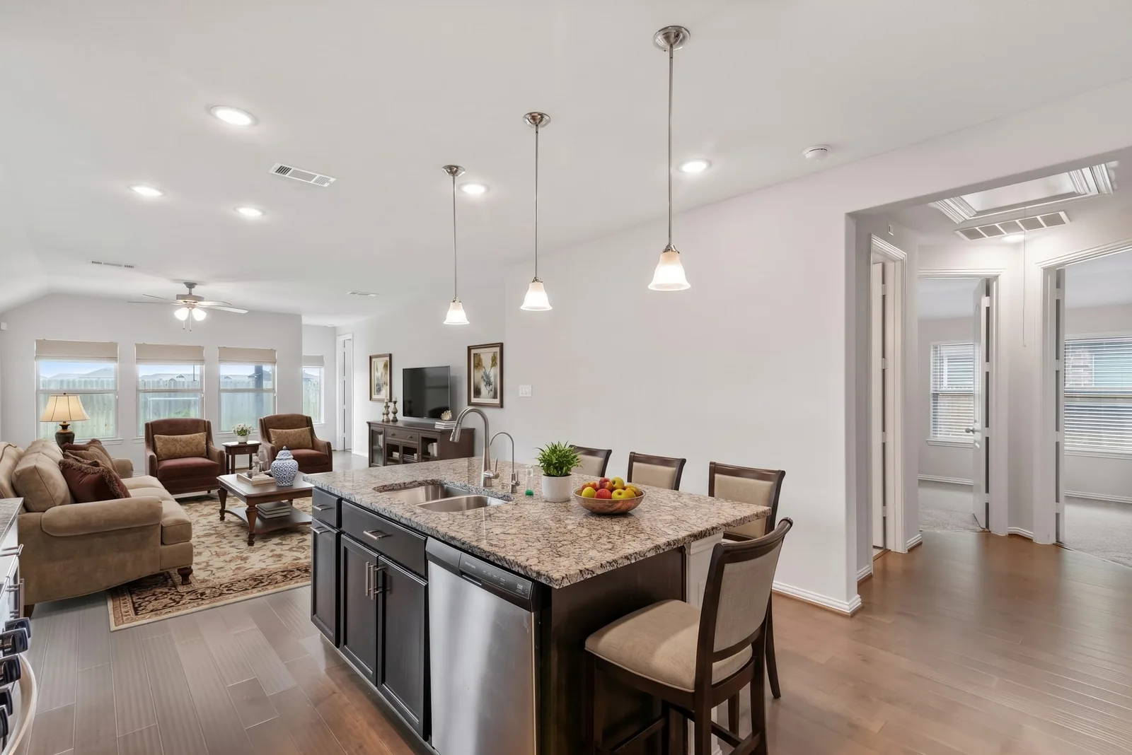 Kitchen & living area, virtually staged in a Traditional style by AI