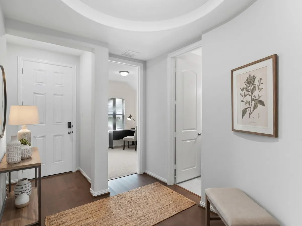 Transitional virtual staging style — entry hall, staged by AI